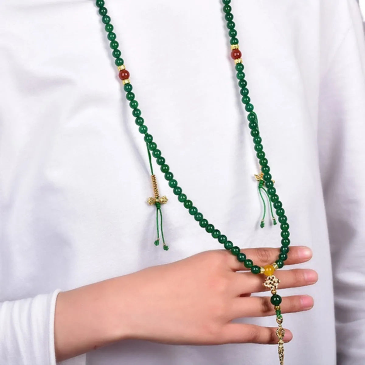 Multi-strand green agate bracelet for men and women on wrist, showing natural stone beads.