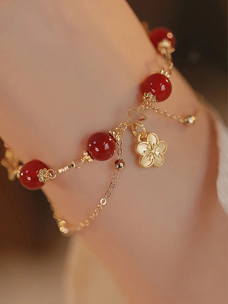 A red agate double layer bracelet with floral details for women.