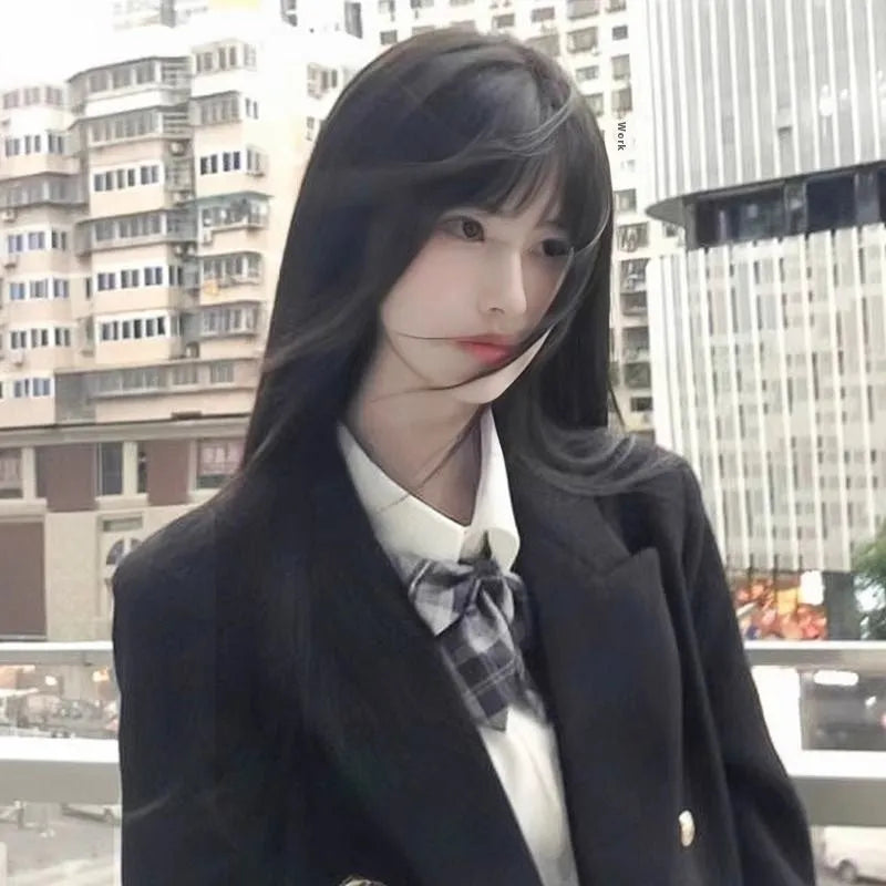 Long straight synthetic wig with bangs in brown black colour showing medium parting style