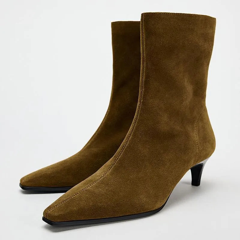 Brown square toe mid heel boots with side zip on a white background.