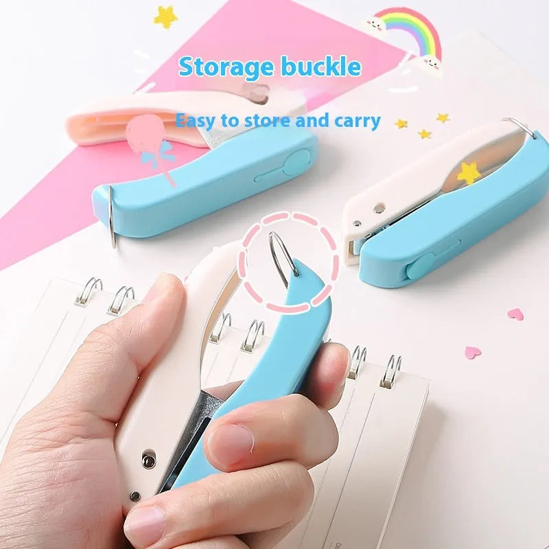 Manual handheld craft punching machine with love, star, and round dies for children's paper projects.