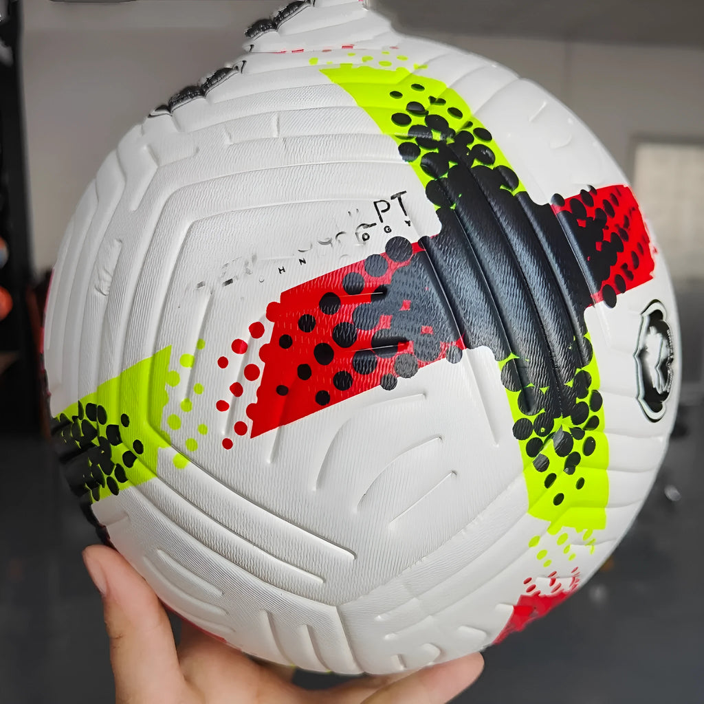 Fluorescent green official size 5 football with seamless thermal patch construction on a pitch.