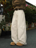 Men's pleated straight loose trousers in black colour with micro-elastic waistband and straight leg opening