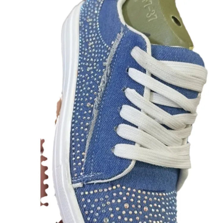 Plus size women's low-top lace-up casual shoes with rhinestone detail and a thick rubber sole, in black.