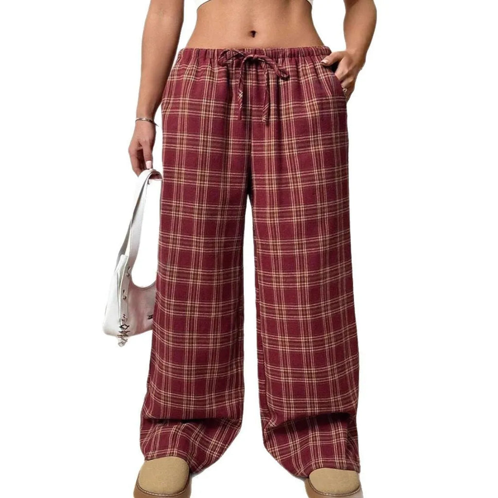 Women's red plaid casual trousers with drawstring waist and patch pockets laid flat