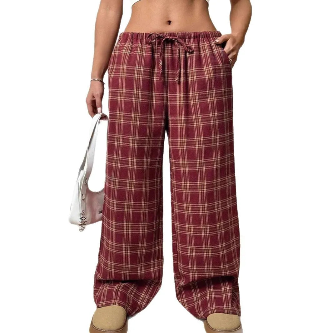 Women's red plaid casual trousers with drawstring waist and patch pockets laid flat