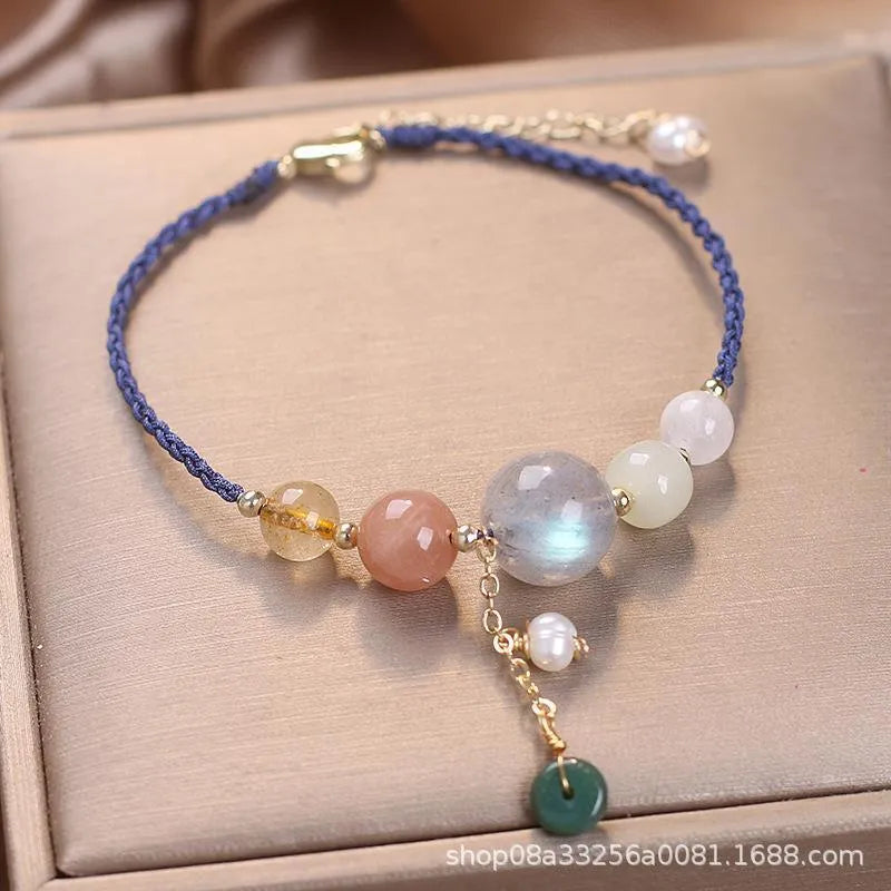 Hand-woven women's bracelet with peace buckle, crystal and sequin accents in red, green and blue colour options