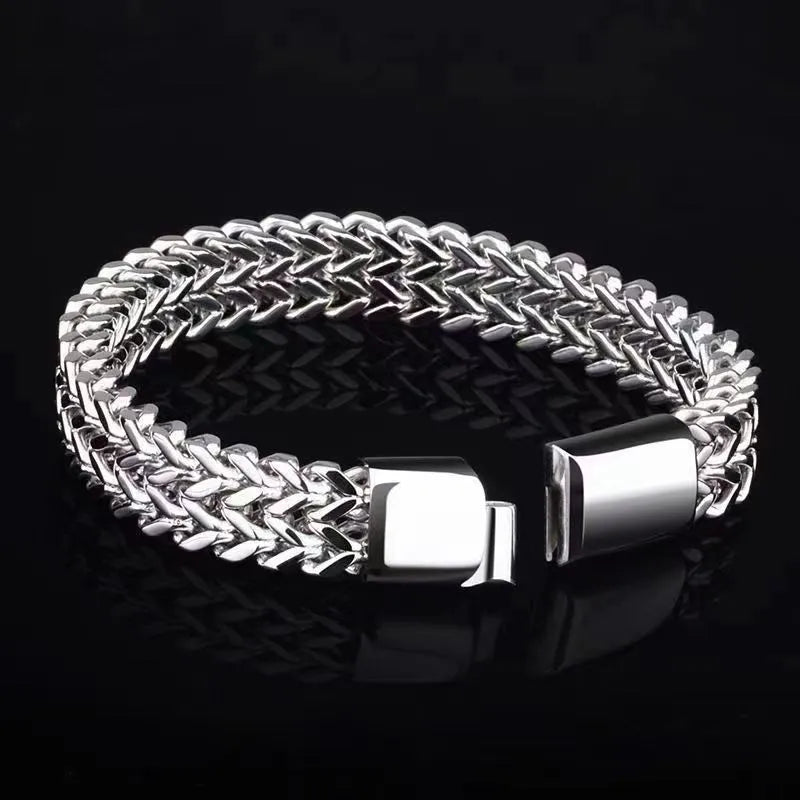 Silver stainless steel men's bracelet with geometric links, showing hip hop style on a wrist.