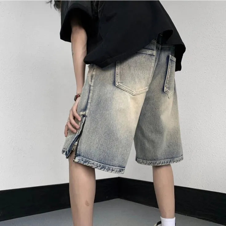 Blue retro tattered denim shorts with wide leg cut on mannequin