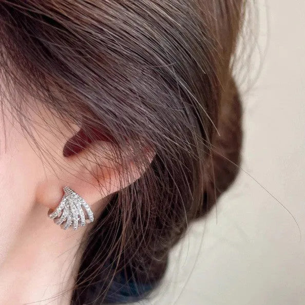 Geometric zircon earrings with platinum electroplated finish and line design details