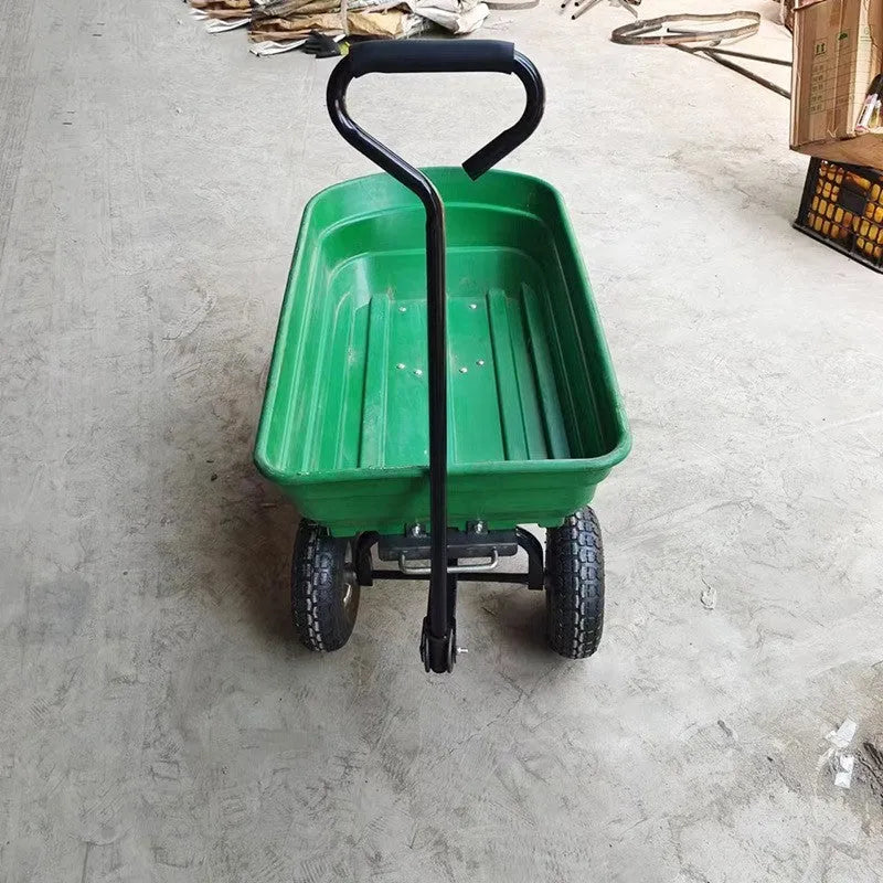 Green four-wheel steel and plastic dumptruck with a large hauling bed.