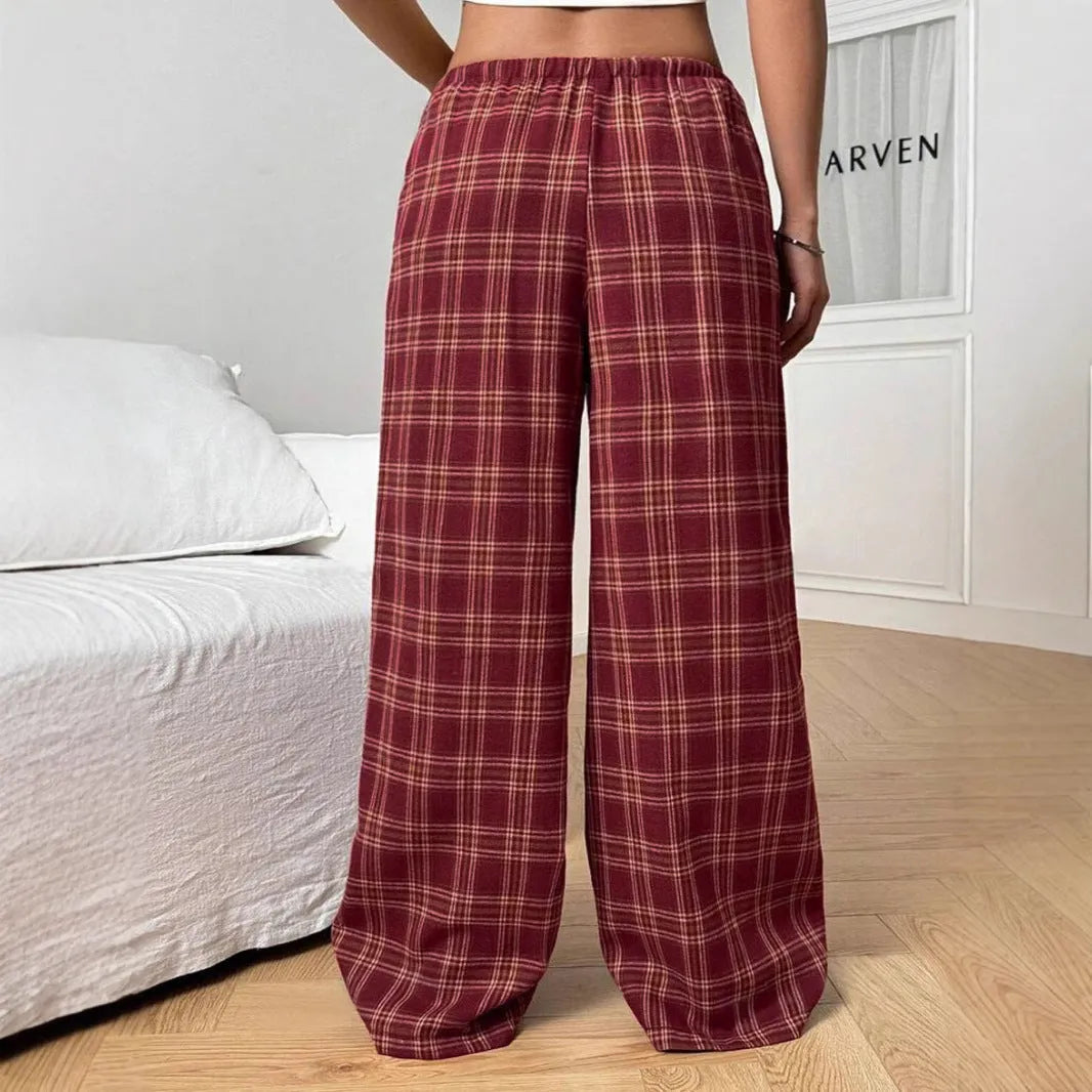Women's red plaid casual trousers with drawstring waist and patch pockets laid flat