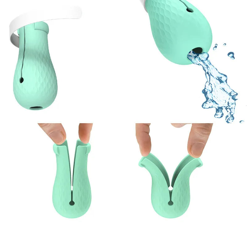 Four green silicone cat paw scratch protection covers for pet grooming.