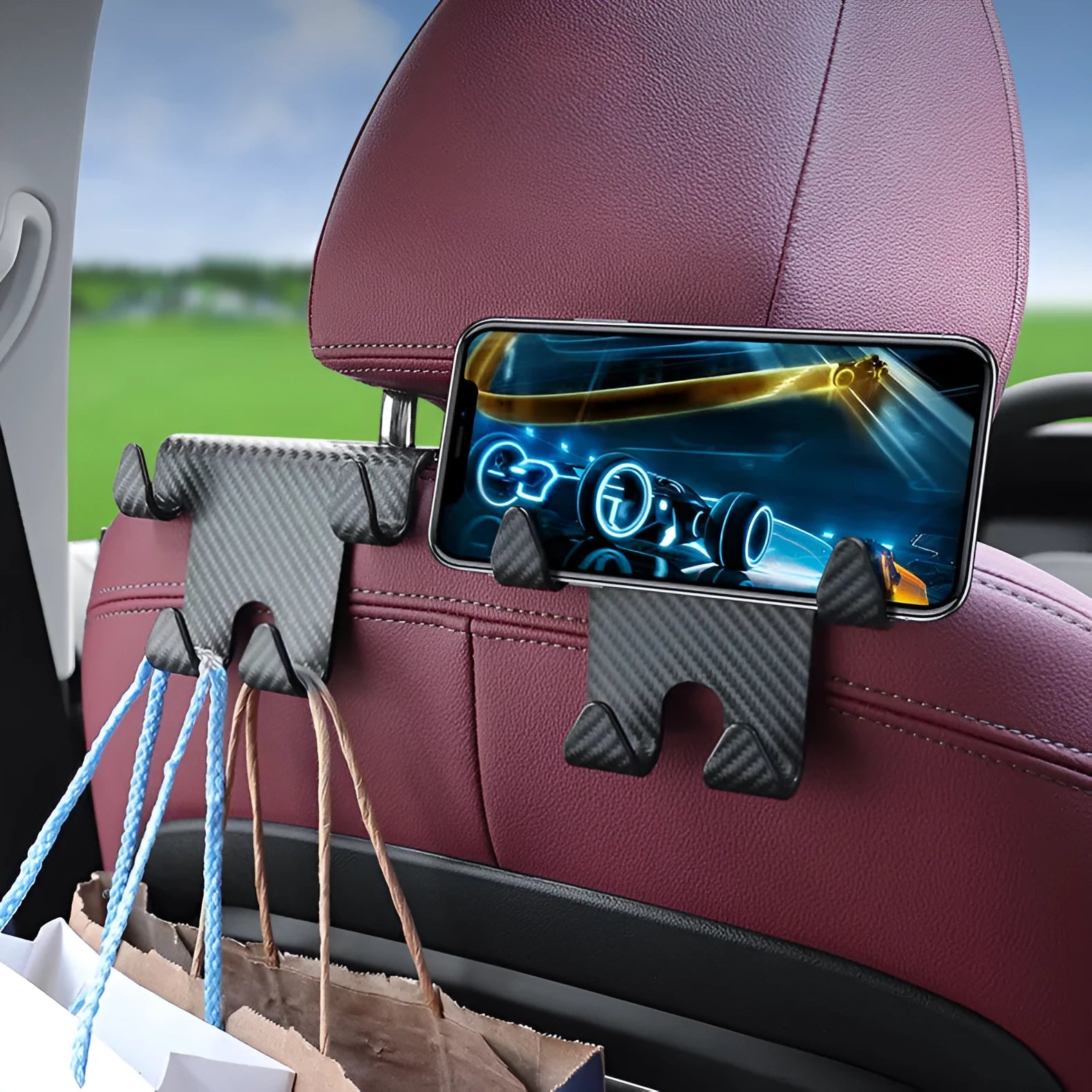 Black ABS plastic car multifunction hook and mobile phone holder bracket for rear seat storage.