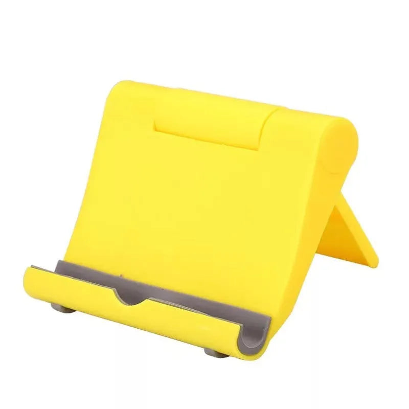Black PE folding mobile phone stand holding a tablet at an angle on a desktop.