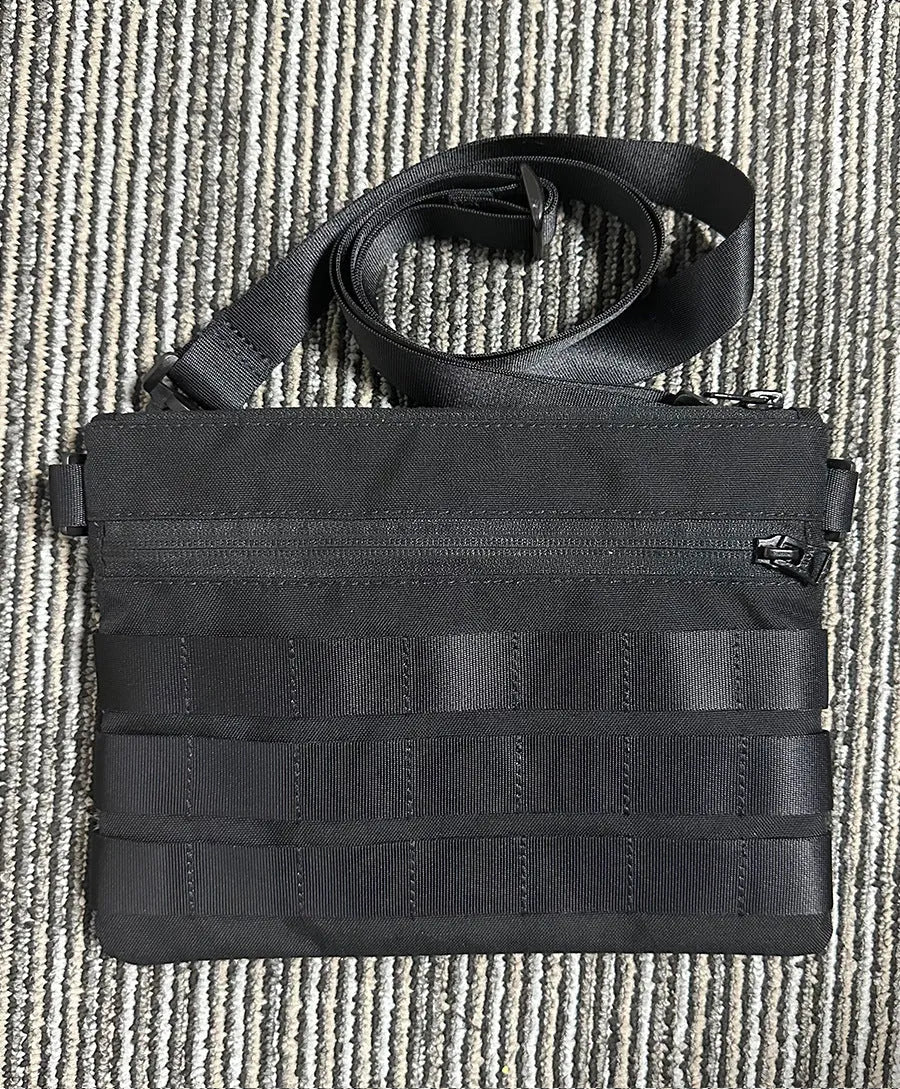 Black oxford cloth portable outdoor kit measuring 18cm by 3.5cm