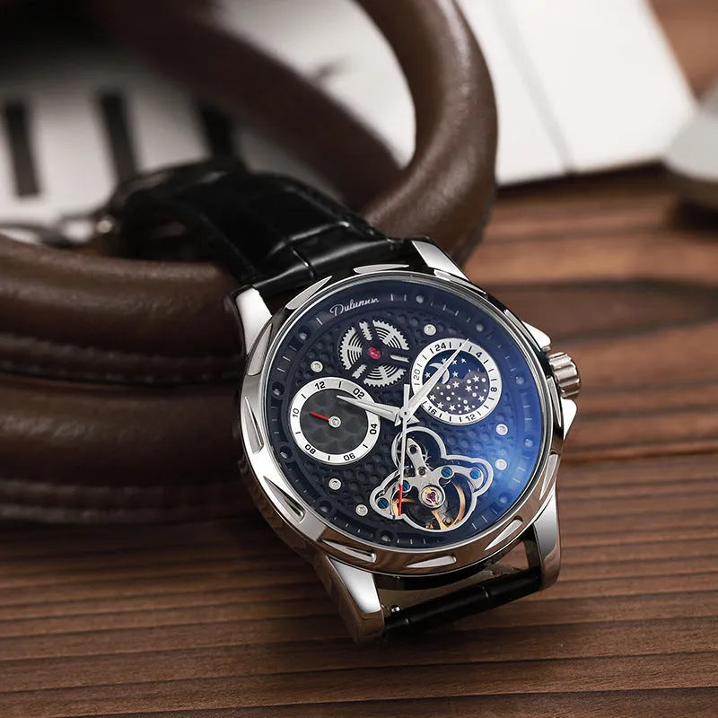 Men's automatic watch with black dial and steel bracelet showing luminous hands.