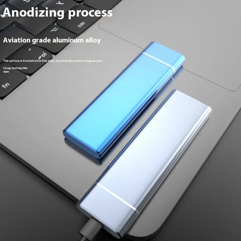 Sapphire blue metal external hard drive with USB cable on a white surface.