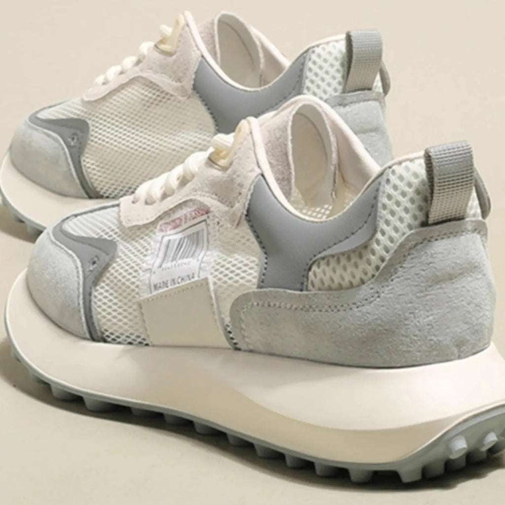 Women's casual retro sneaker in grey or pink with low-top design and round toe