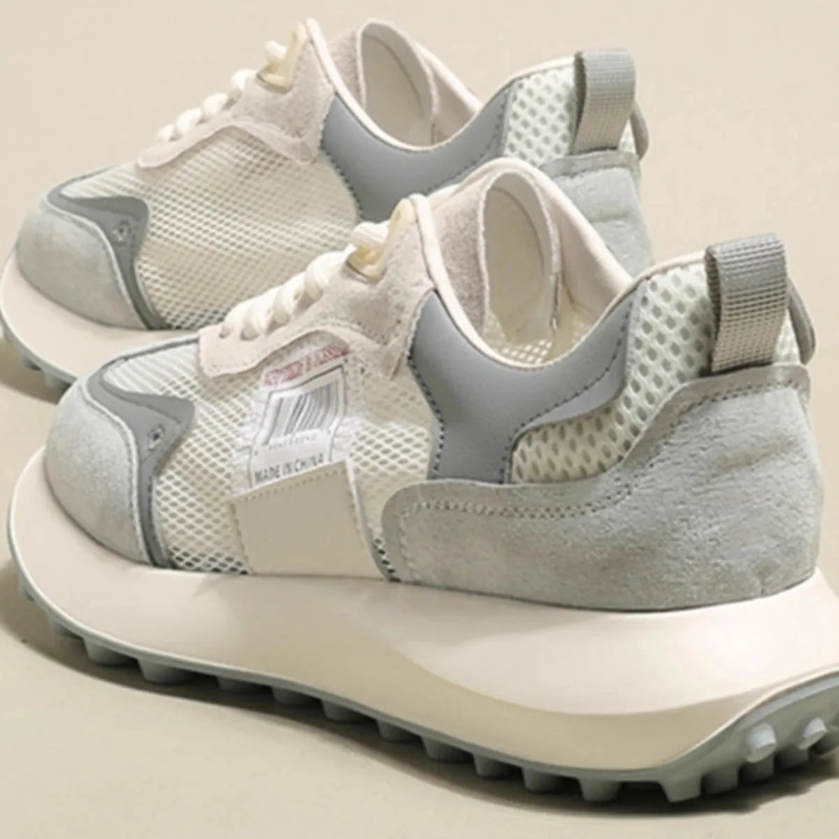 Women's casual retro sneaker in grey or pink with low-top design and round toe