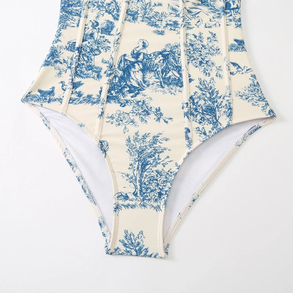 Women's blue one-piece swimsuit set with matching gauze skirt on a size chart