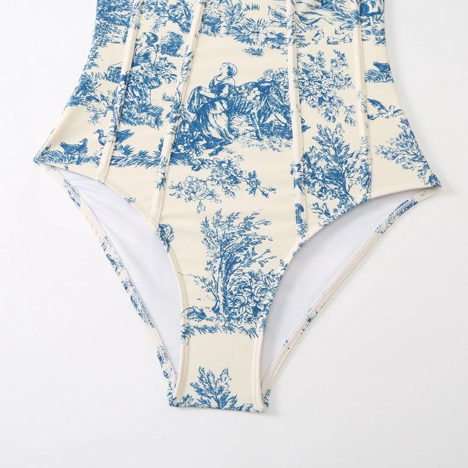 Women's blue one-piece swimsuit set with matching gauze skirt on a size chart