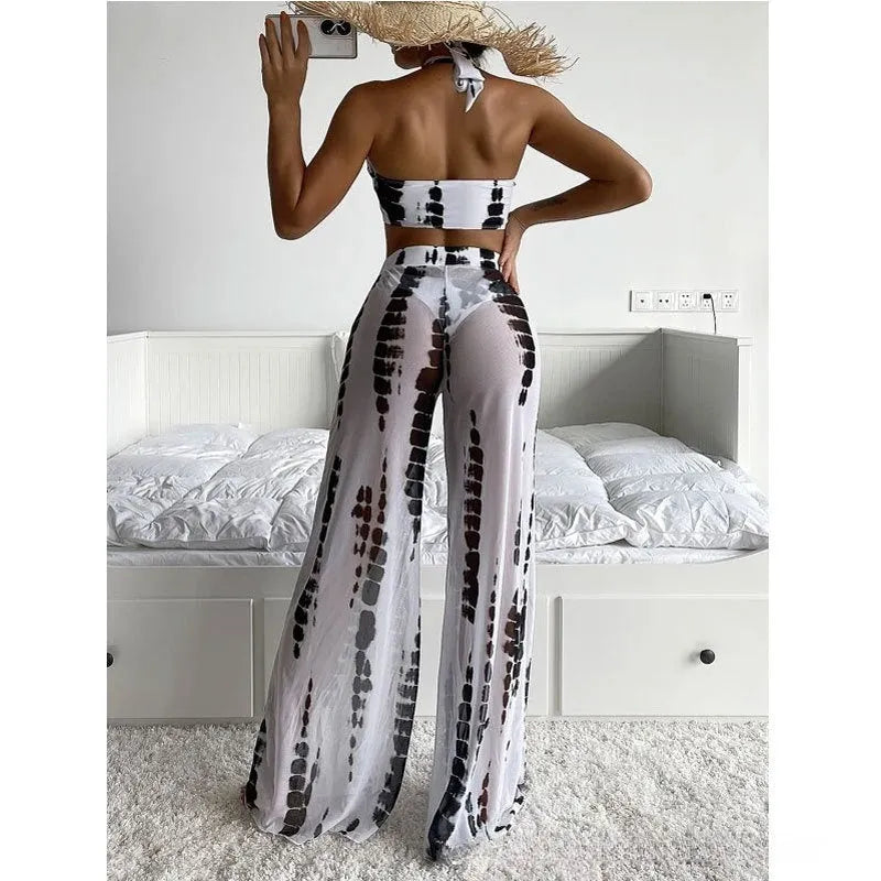 Three-piece women's swimsuit set with bikini top, bottoms, and matching mesh trousers