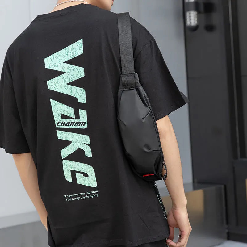 Black Oxford cloth waist pack with crossbody strap showing multiple interior compartments
