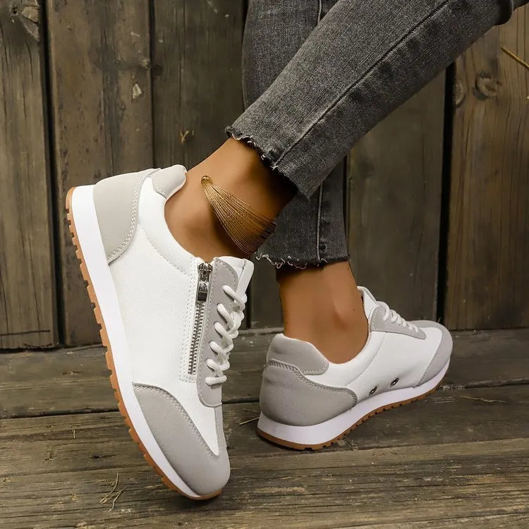 Women's flat-heeled shoes in artificial PU, shown in grey, white, and Champagne colours on a rubber sole.
