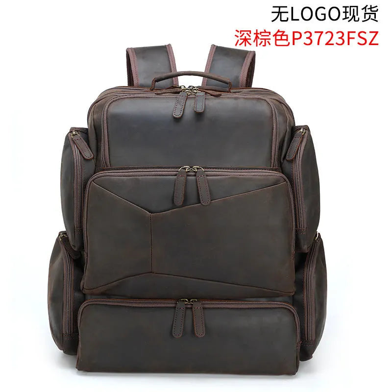 Dark brown retro genuine leather backpack for men, open to show laptop compartment and internal organisers.