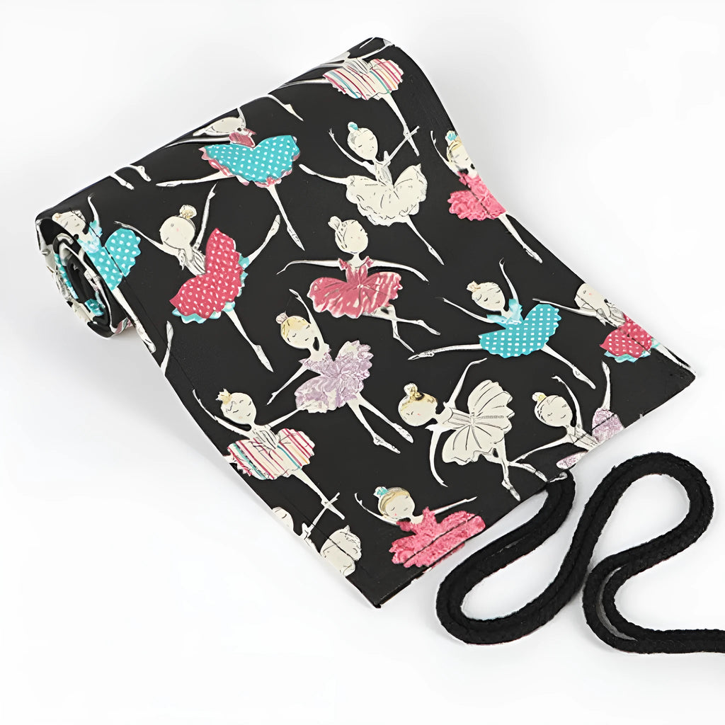 Rolled-up canvas pencil case with ballet girl print, showing multiple pencil slots.