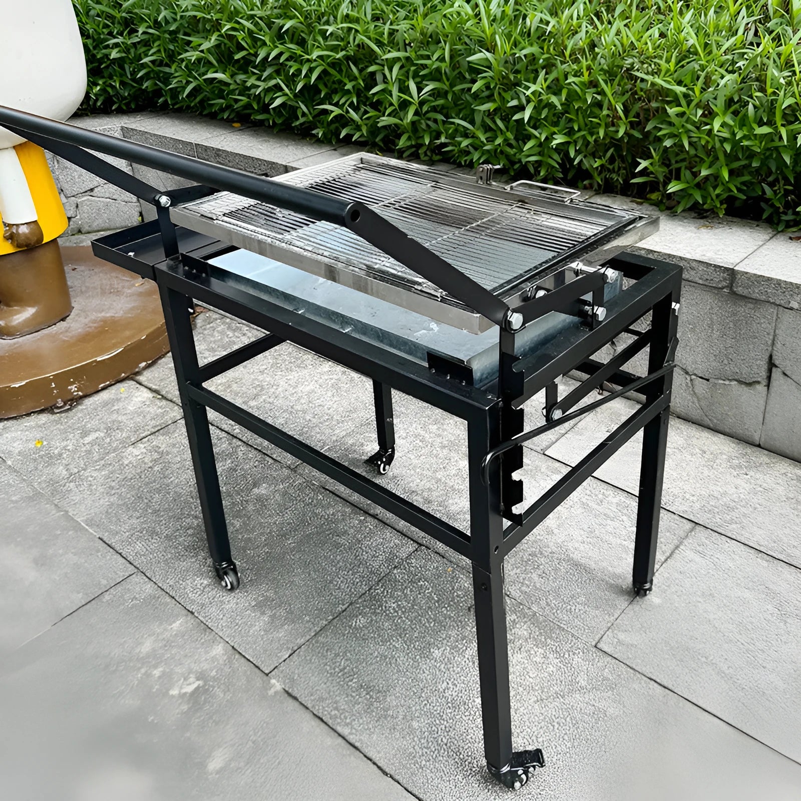 Portable foldable charcoal barbecue grill with detachable legs for outdoor cooking