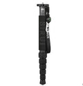 Black carbon fibre SLR camera monopod extended to full height with six sections visible