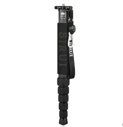 Black carbon fibre SLR camera monopod extended to full height with six sections visible