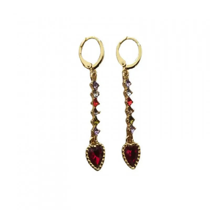 A pair of gold-coloured heart-shaped metal earrings for women.