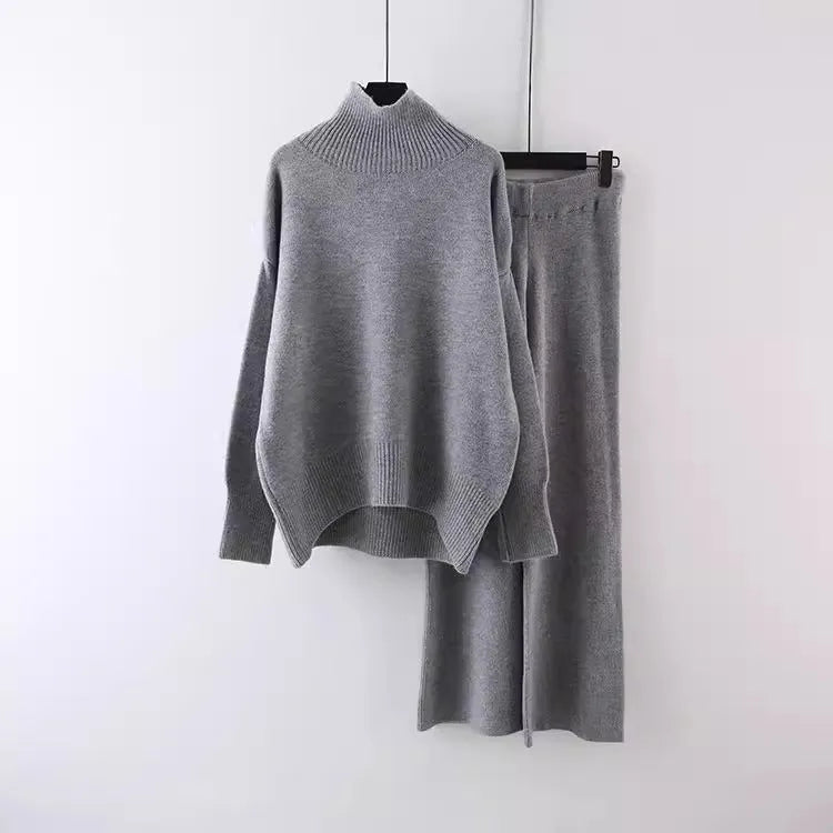 Women's beige casual sweater and wide-leg pants two-piece set on a hanger.