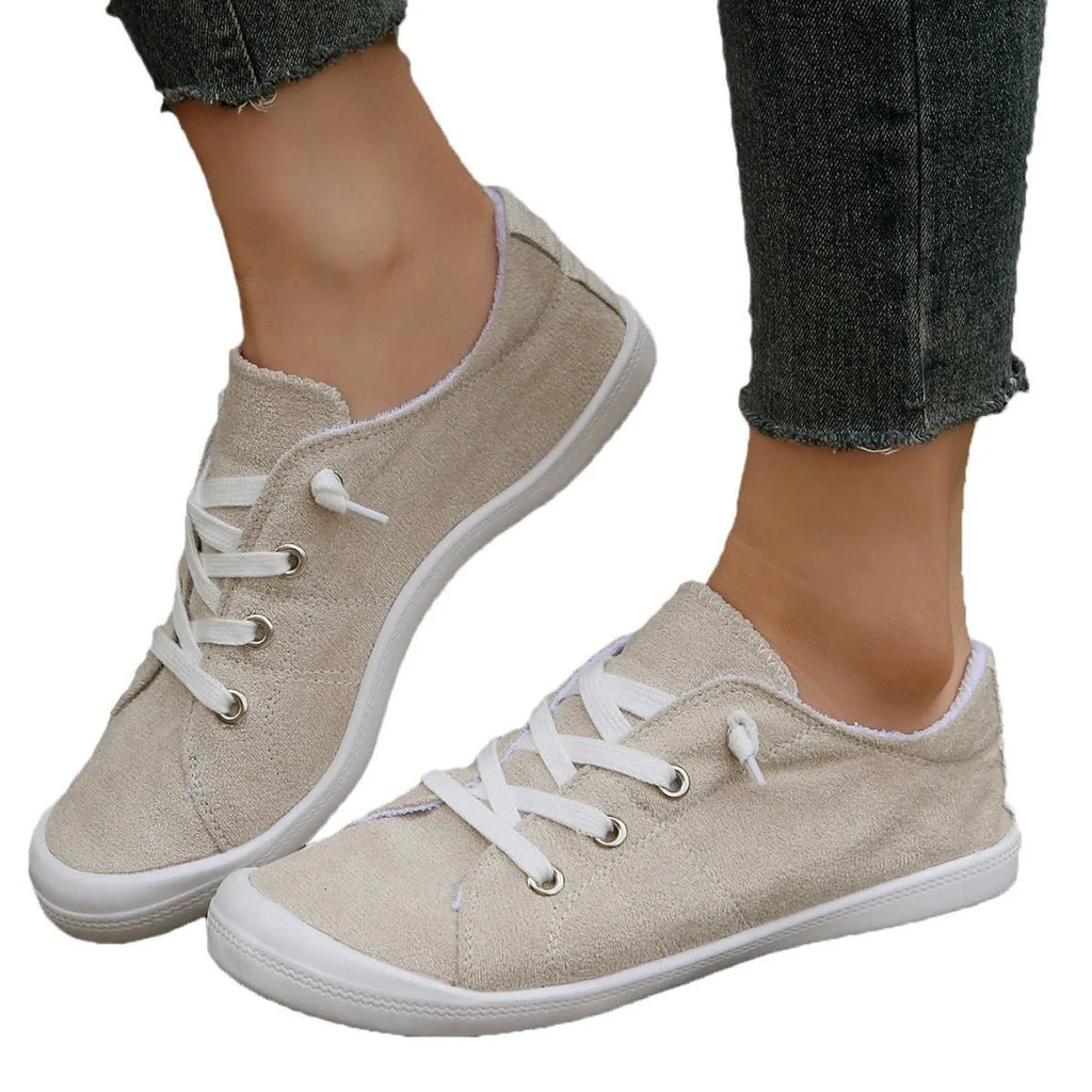 Women's creamy white fabric casual sneakers with rubber sole low top design