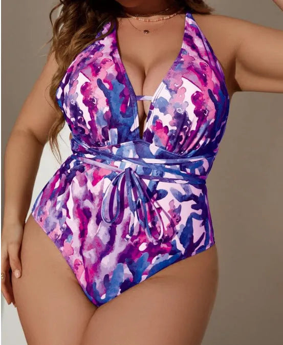 Solid purple halter swimsuit on a mannequin, showing the one-piece bikini briefs style.