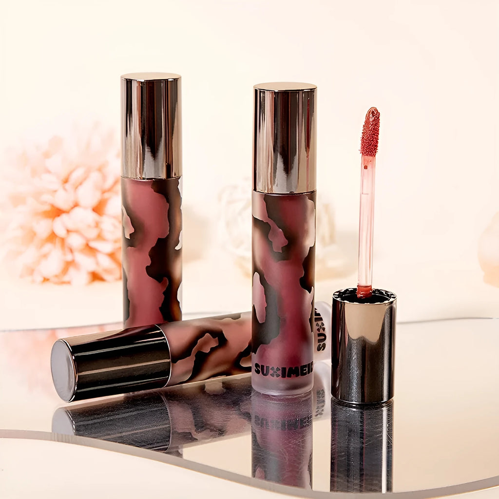 Matte liquid lipstick tube showing five colour options including orange brown coffee and jujube red