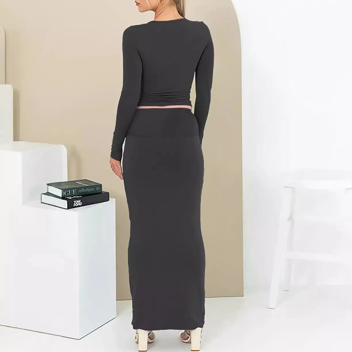 Women's black polyester two-piece suit with a top and long skirt for autumn.