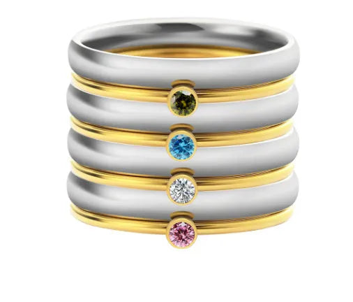 December birthstone geometric engraved ring in titanium steel on a hand.
