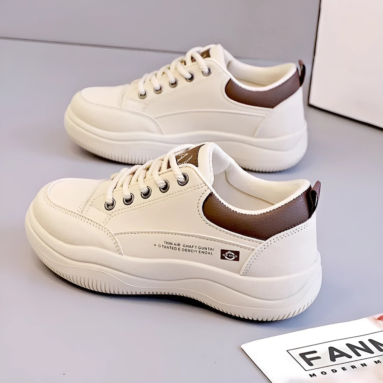 Women's white Korean-style lace-up shoes with cross-strap detailing and flat mid heel