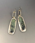 Geometric alloy earrings with two-colour marble pattern, showing angular shape and blended colour effect