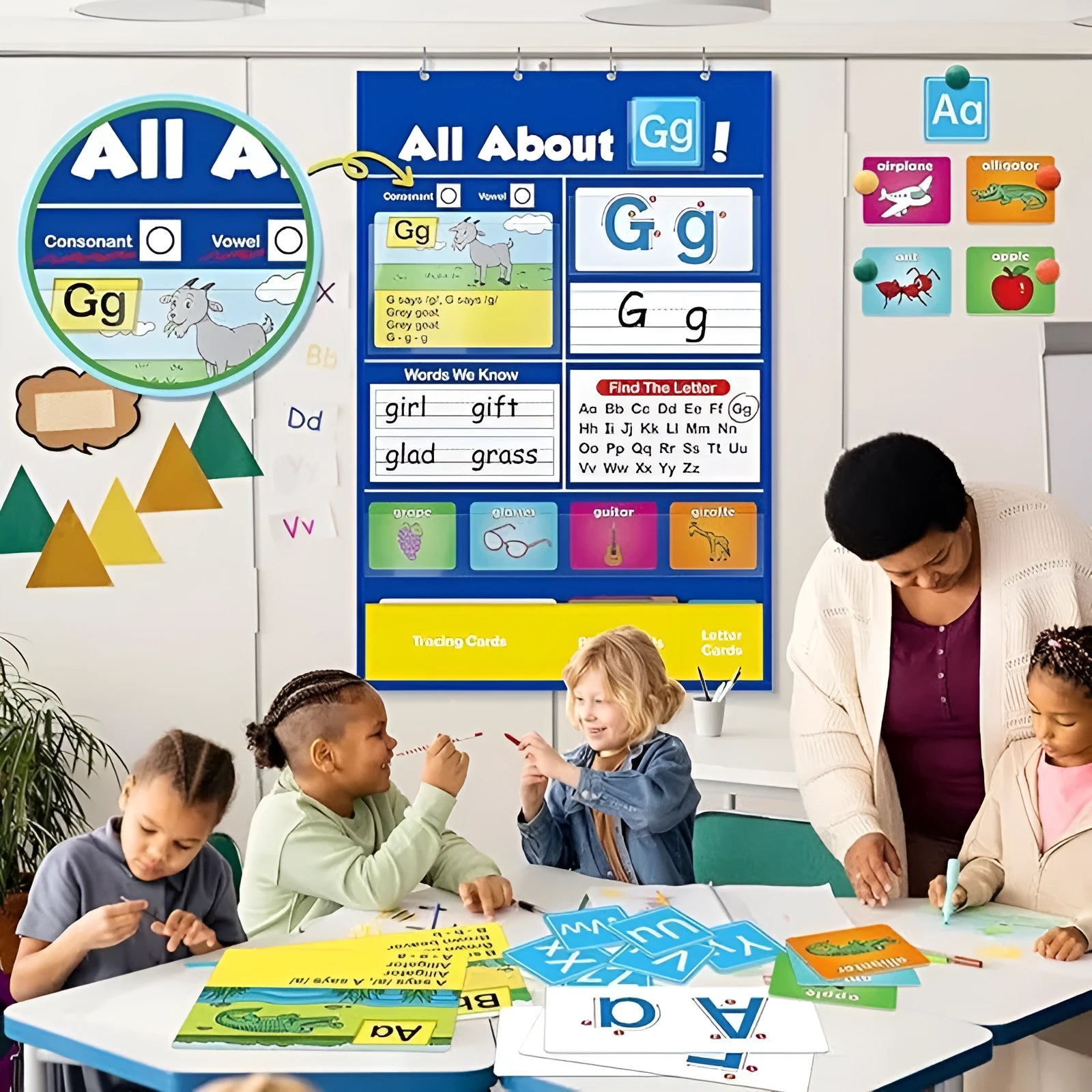 Large blue alphabet learning chart with scattered letter cards, word cards, and picture cards for children.