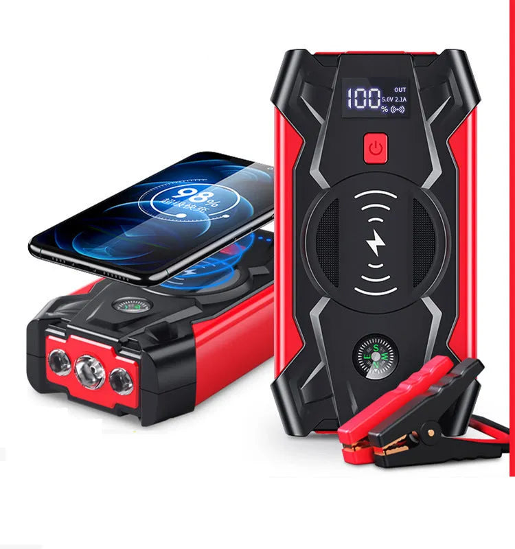 Red 12V portable car jump starter power bank with battery clips on a black background.