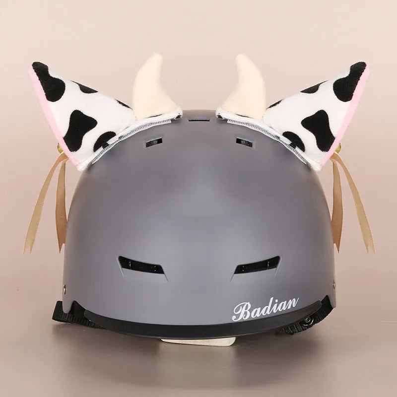 Cute plush cartoon character helmet cover and matching hat costume set on a white background.