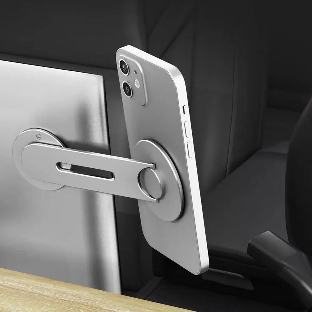 Silver aluminium alloy magnetic suction car phone holder on a grey background, showing its slim profile.