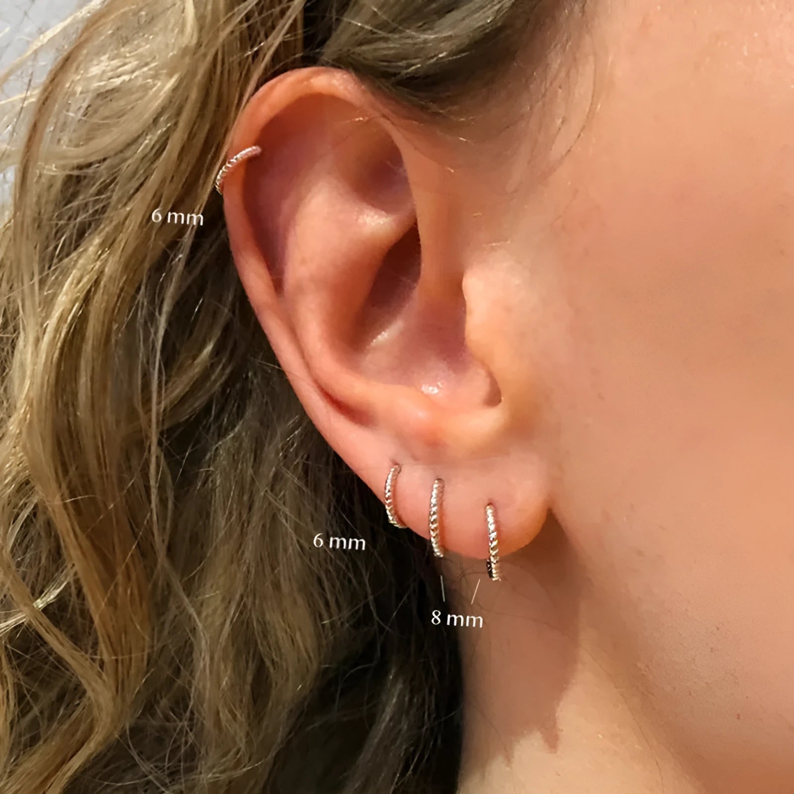 Sterling silver twisted round earrings in gold or white gold finish showing geometric design and S925 marking