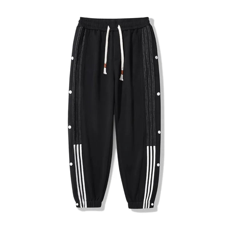 Men's black loose-fit cotton blend sweatpants with ankle ties and a drawstring waist.