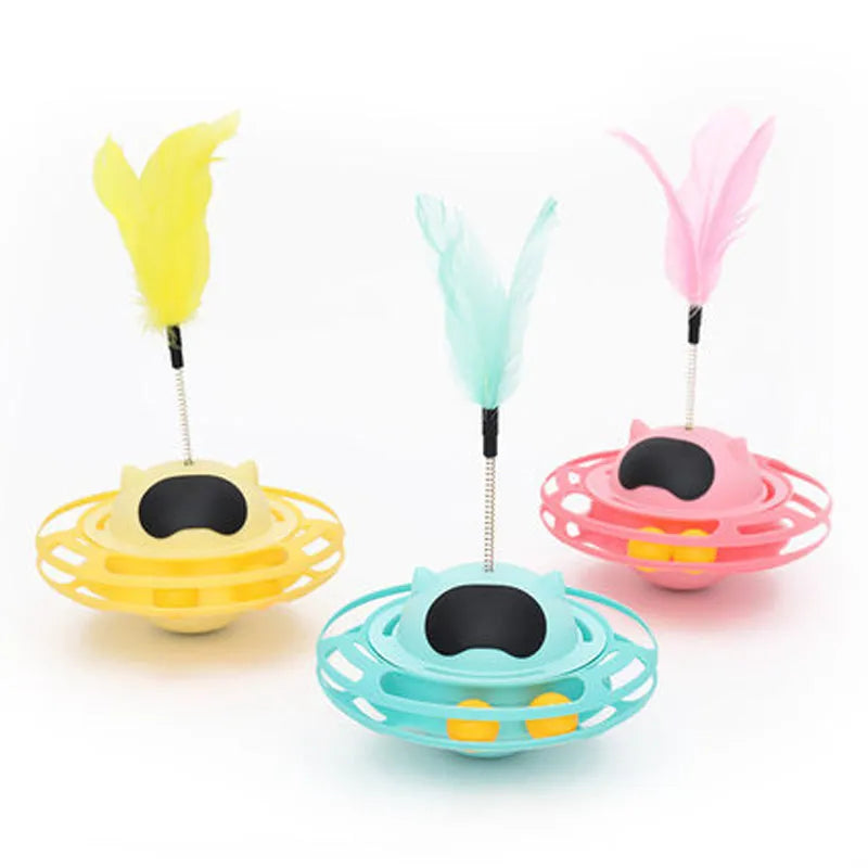Pink cat tumbler turntable toy with self-hi feature for independent play
